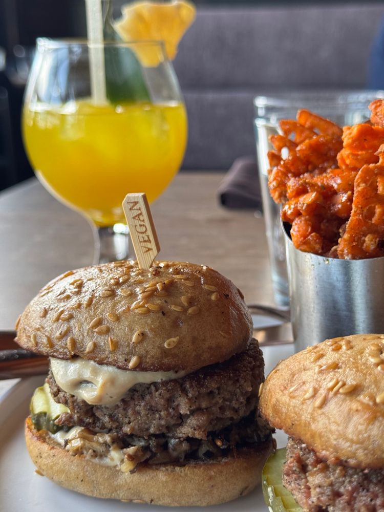 Vegan and gluten free impossible sliders, hot honey sweet potato waffle fries, and a mocktail. 