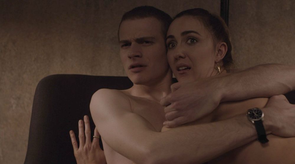 Sam and Tracey on a couch startled by the monster in the Glass Box from Twin Peaks Part 1