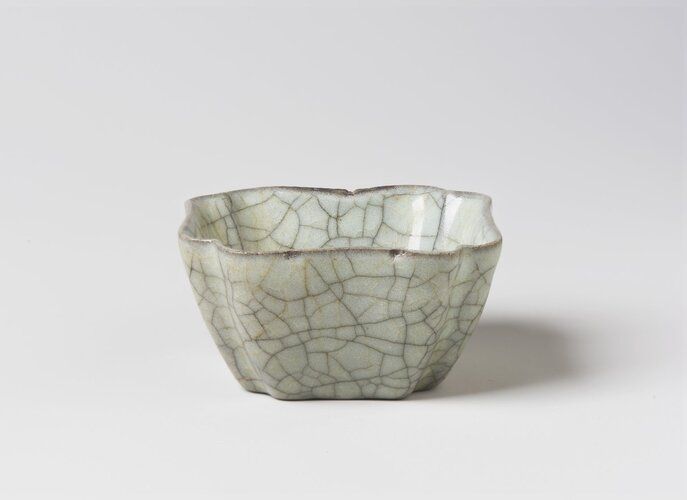 The "Square Flower-Shaped Washer" from the Brooklyn Museum's Asian Art collection exemplifies exquisite craftsmanship, with its delicate floral form reflecting traditional Asian motifs. This piece illustrates the sophistication and attention to detail that characterize functional art objects in historical Asian cultures.