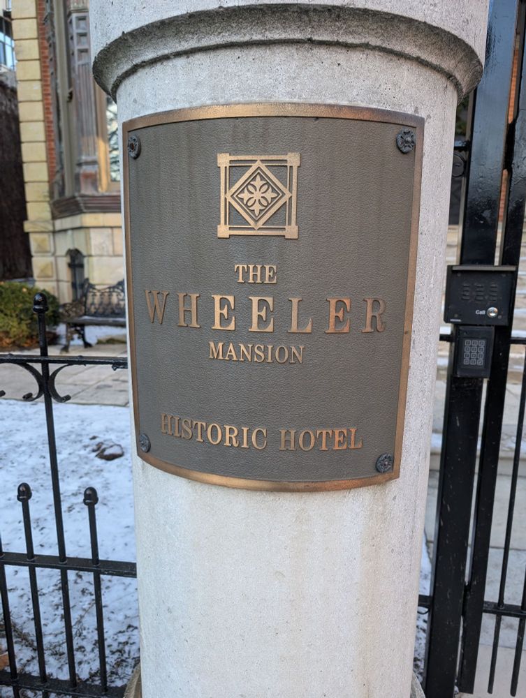 A plaque that reads "The Wheeler Mansion Historic Hotel" located in Chicago
