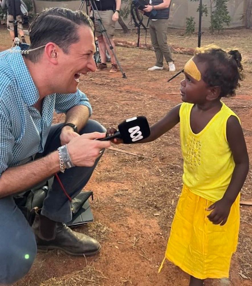 Dan Bourchier, speaking with young girl at GARMA festival 