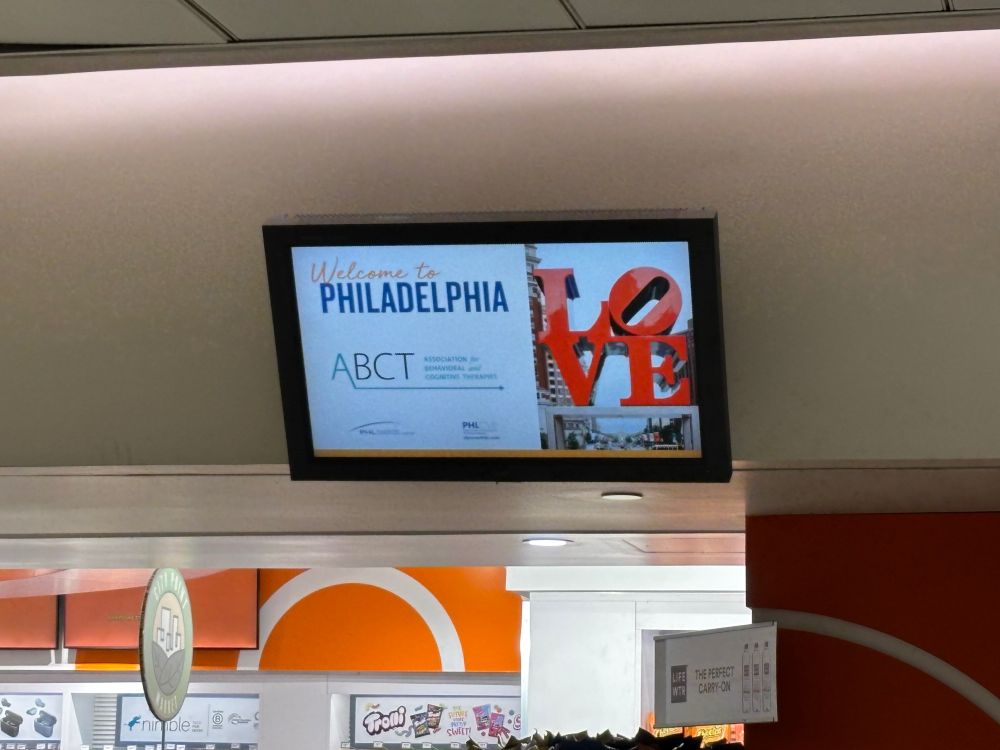 Airport monitor with ABCT logo and the Philadelphia LOVE statue