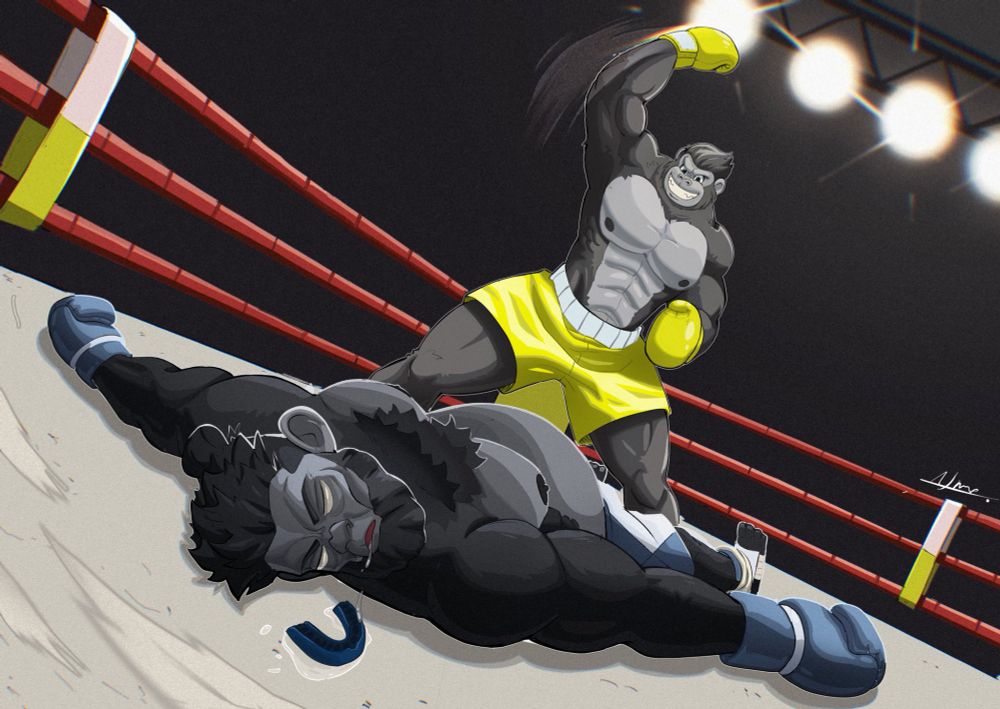 Artwork of Elvis the gorilla standing over an unconscious Tyrone in a boxing ring as he strikes a flashing uppercut pose. Elvis is wearing an all-yellow boxing outfit while flashing a winning smile. Meanwhile, Tyrone is wearing a pair of blue and white boxing gloves and matching trunks and leg gear, the knocked-out ape is laying of the floor, spread-eagle as he lays in a puddle of his own drool. Next to him is his knocked-out mouthguard as he looks at it with lifeless eyes. 