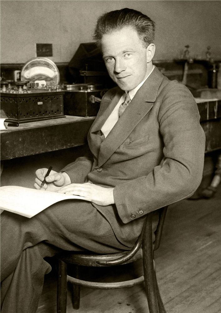 A black and white portrait of a young Werner Heisenberg