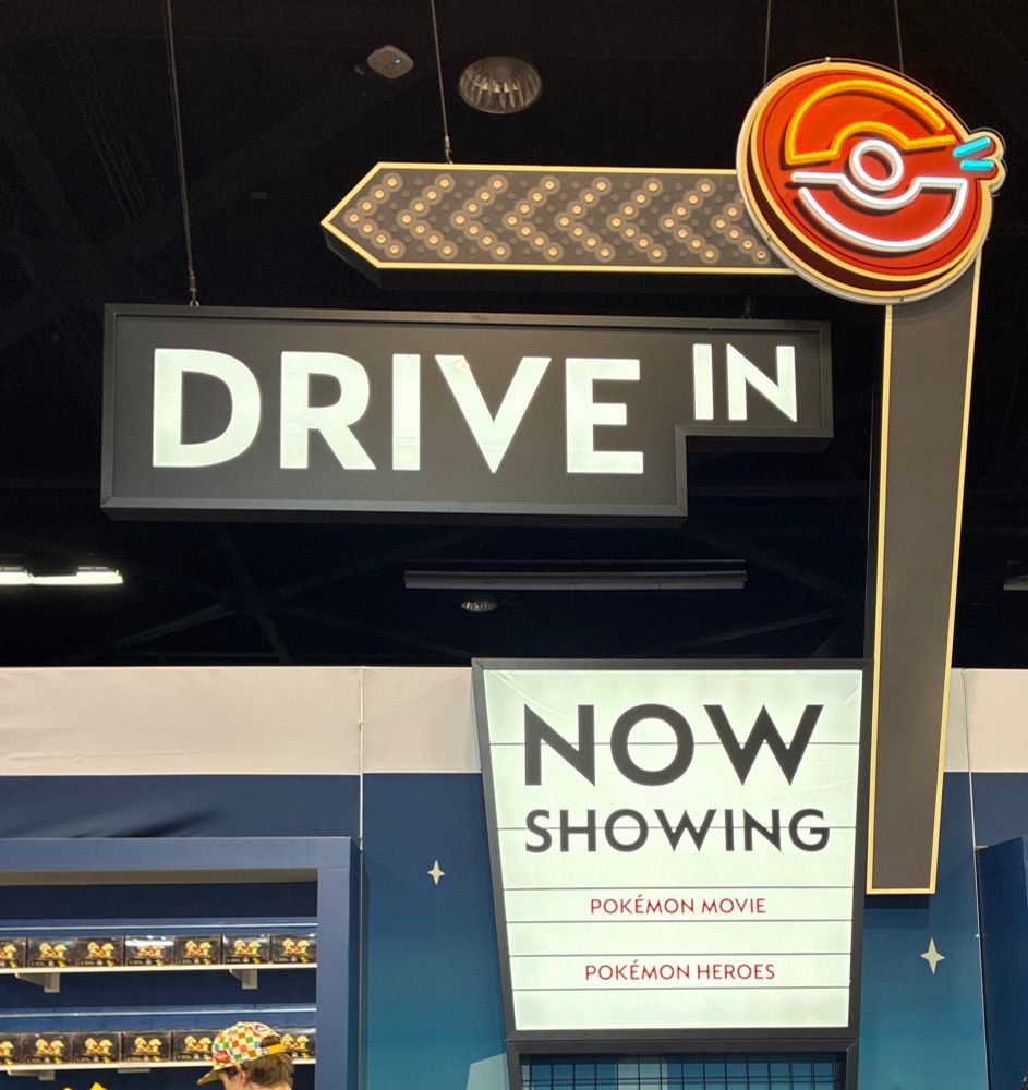 Drive in theater sign at the Pokémon Center store at worlds 2025 in Anaheim. “Pokémon Heroes” is the listed film on the marquee.