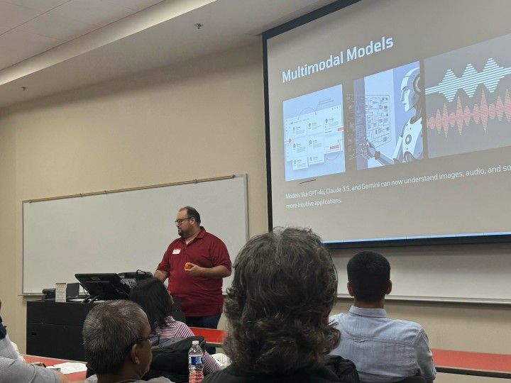 Martin Rojas presenting a talk on AI to a room full of attendees 