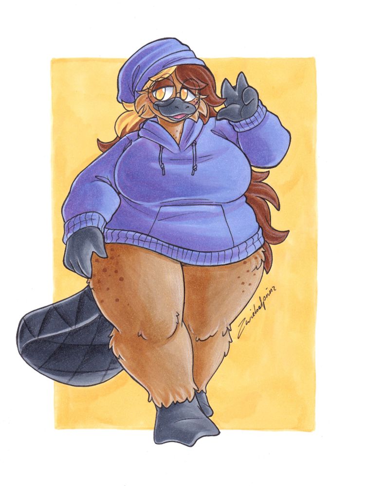 A chubby platypus furry . she has long brown hair with a blond streak. She is wearing a big hoody and a beany