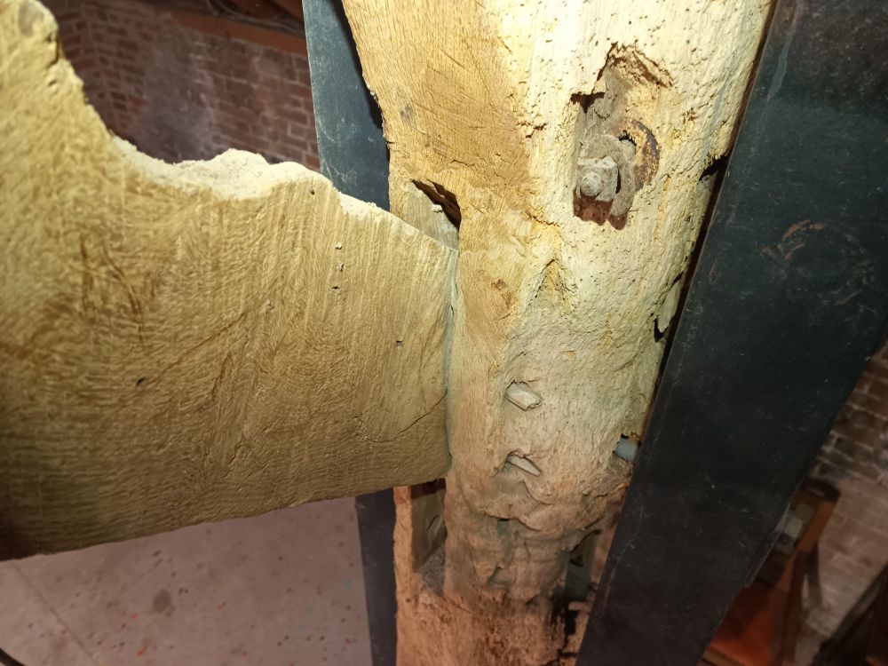 Old wooden beams connected with a mortice joint with gaps top and bottom