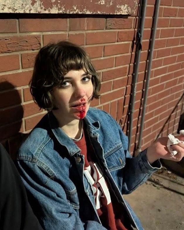 i am sitting outside a bar with a brick exterior, i have blood on my face because i kissed the pavement (clumsy drunk)