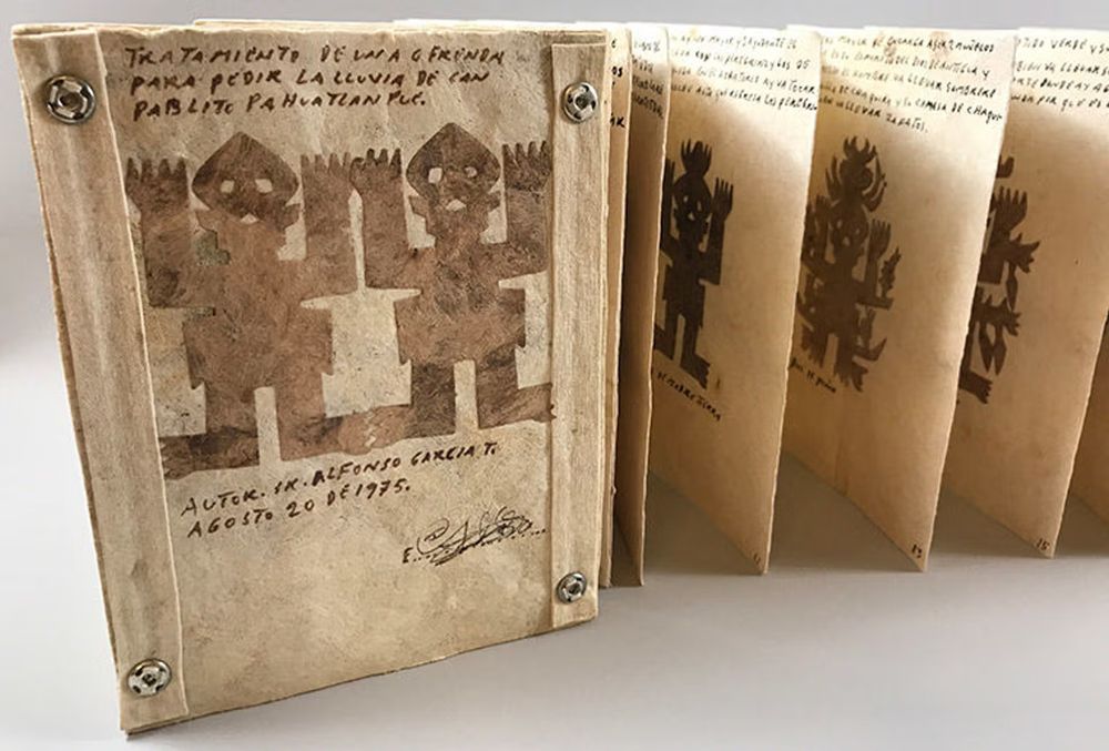 A codex style book of Amate cut paper