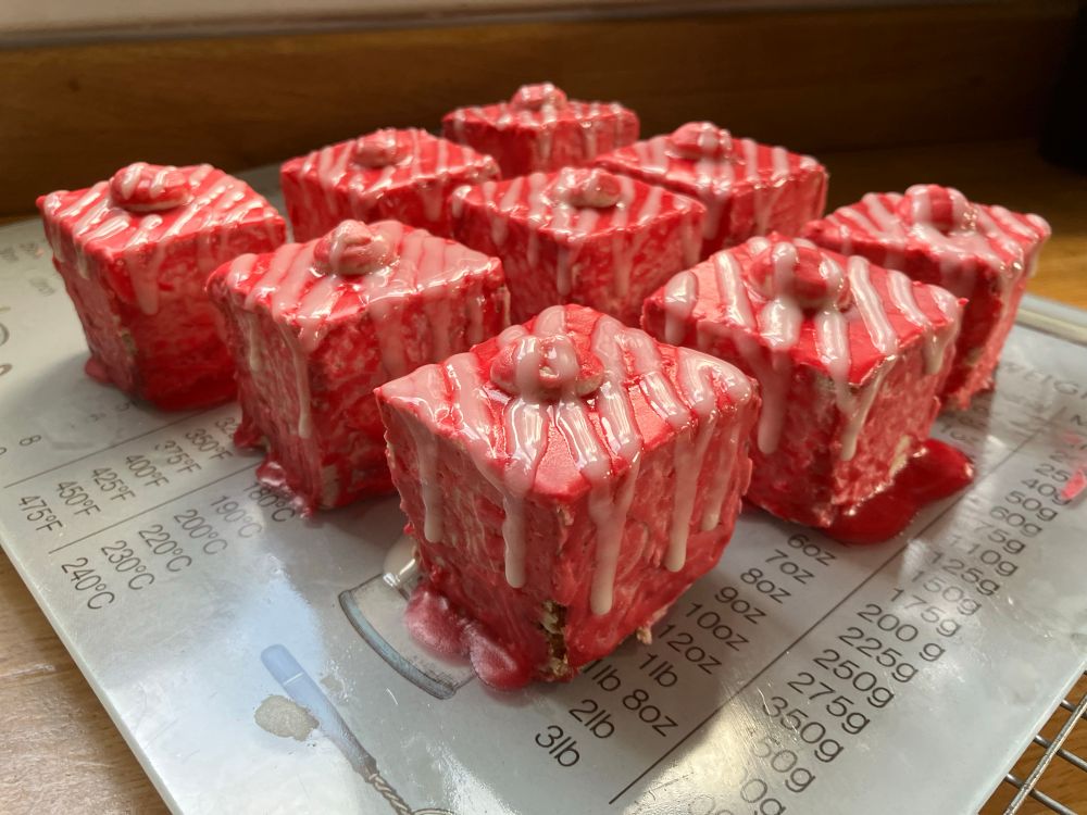 9 5x5 fondant fancies slathered in a rather messy fondant icing