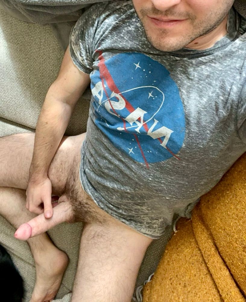 Playing with my 7.5” hard cut cock on the couch wearing a cute NASA shirt 