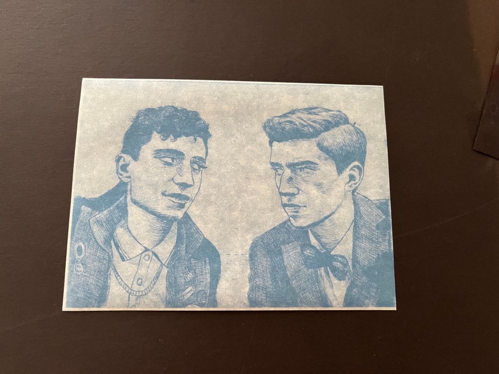 Photo of the exposed cyanotype paper with the motif in blue outlines.