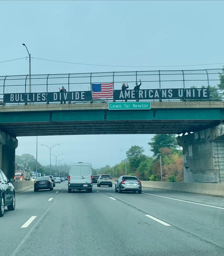 Bullies divide, Americans unite - bridge overpass protest