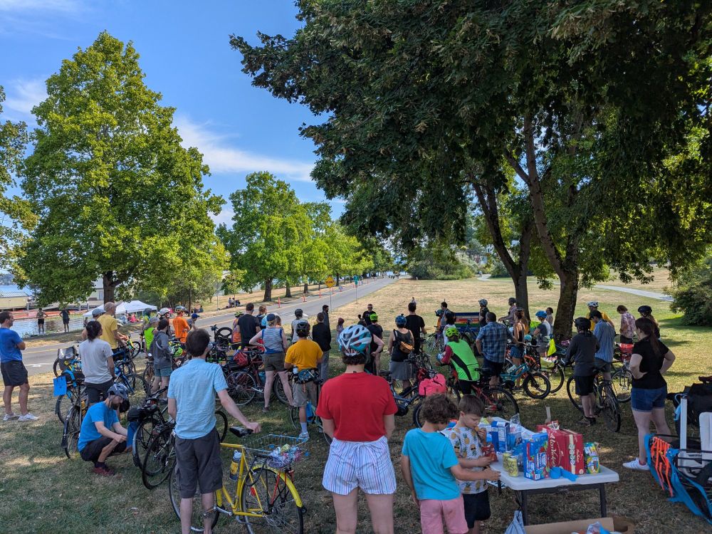 People with bikes listening to speakers before the bike parade