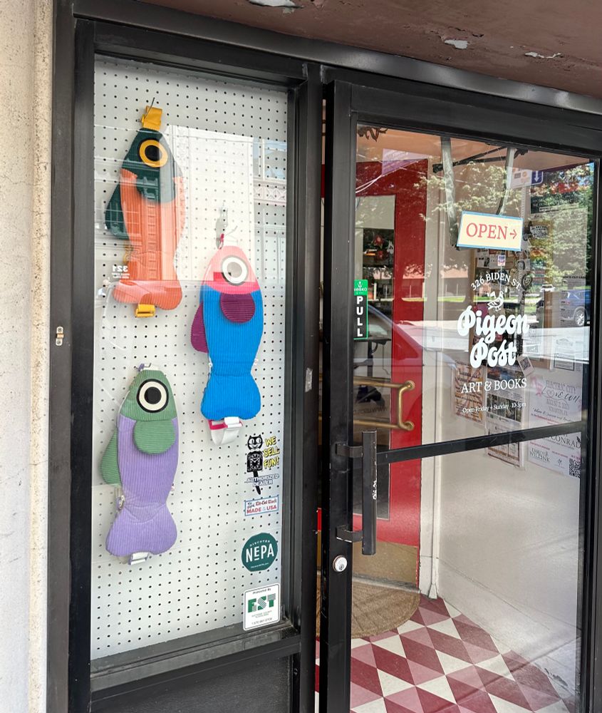 Entrance to Pigeon Post featuring Curlworks fish bags in the window