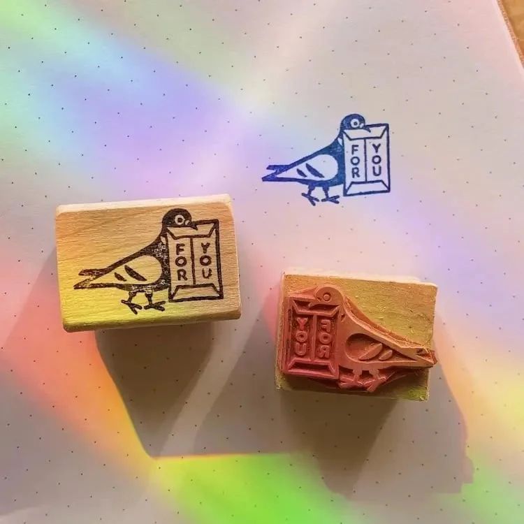 Rubber stamp with a pigeon carrying an envelope in his beak labeled "For You"