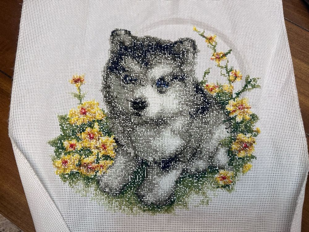 The back of the cross stitch. Just here to show how neat I managed to get it to look. You can see the reflection of the husky and the flowers.