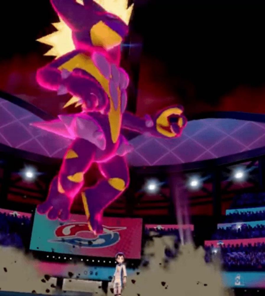 a purple and yellow monster is standing in a stadium