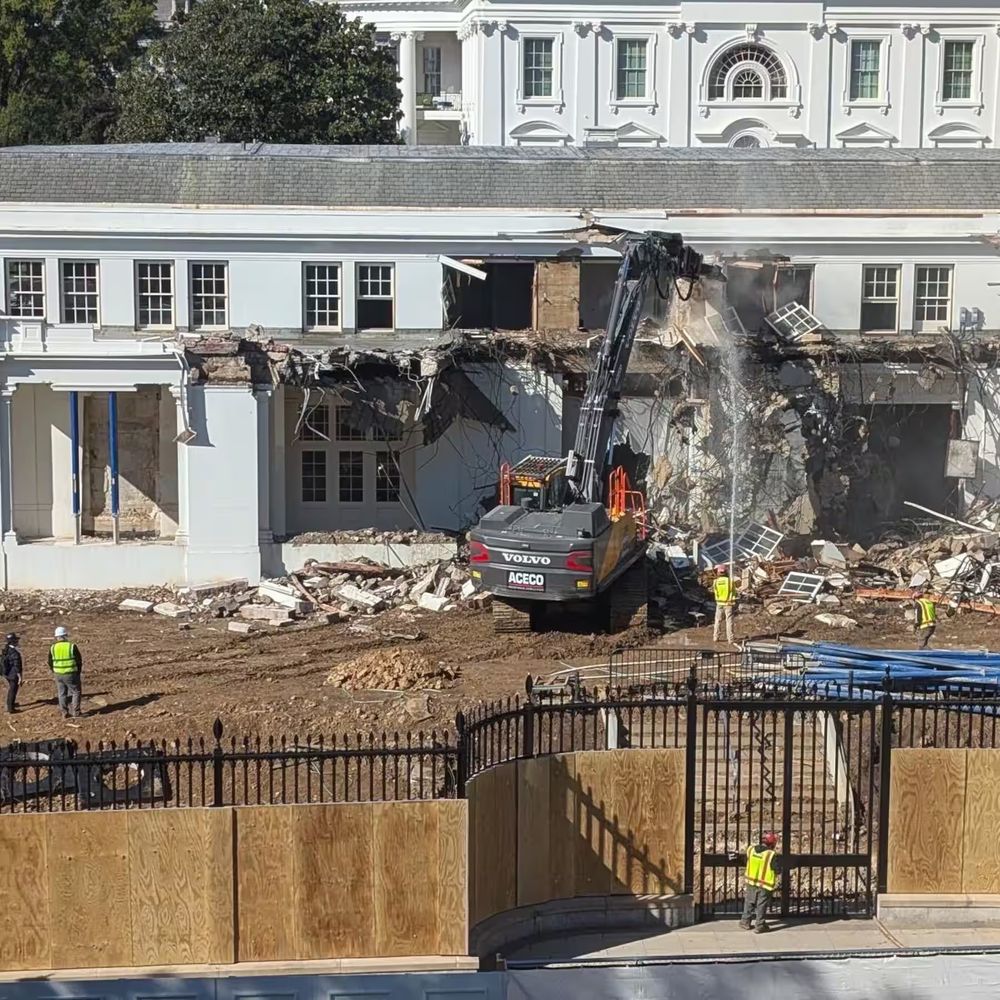 Bulldozer destroying the East Wing. Rubbles.