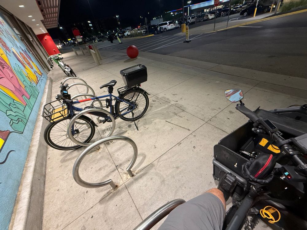 Perspective from sitting on cargo bike at Target bike parking 