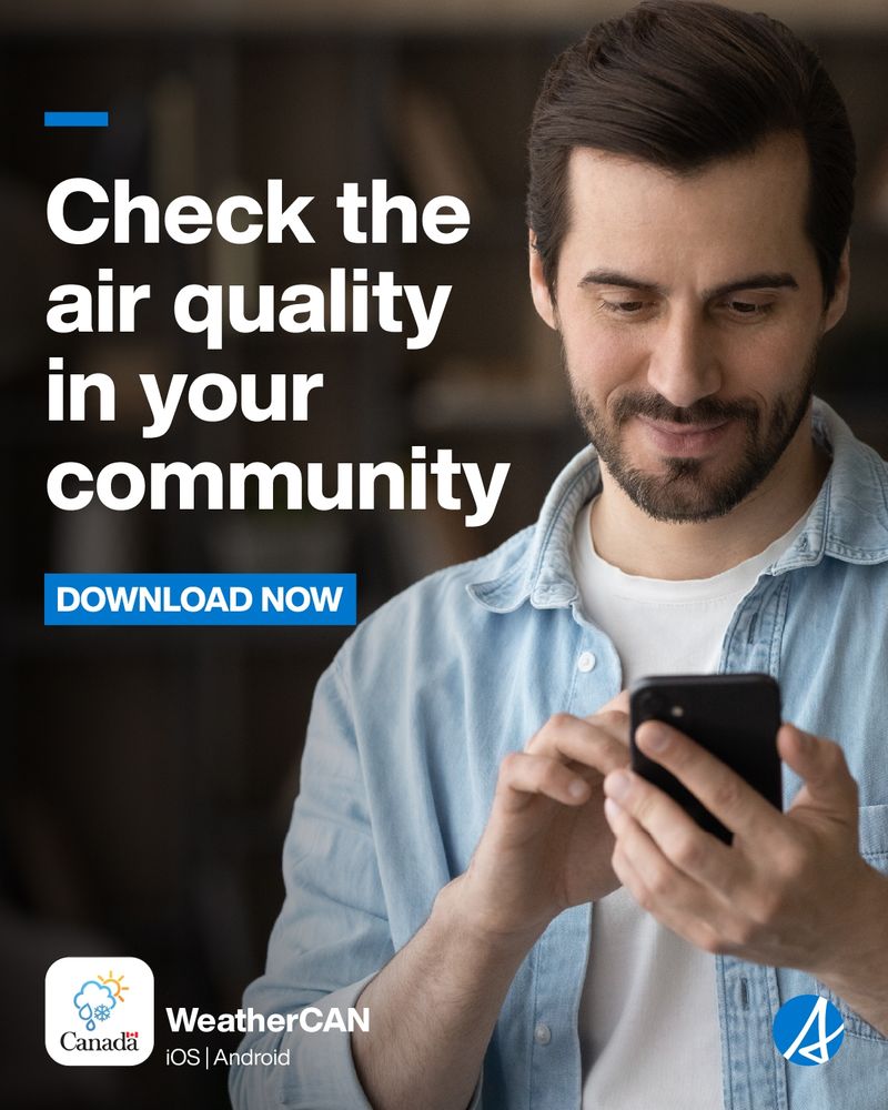 A man with dark brown hair and facial hair, wearing a blue button up shirt over a white t-shirt is looking at his phone. Text reads check the air quality in you community. Download now. The weather can app logo is on the bottom left. The Alberta logo is on the bottom right.
