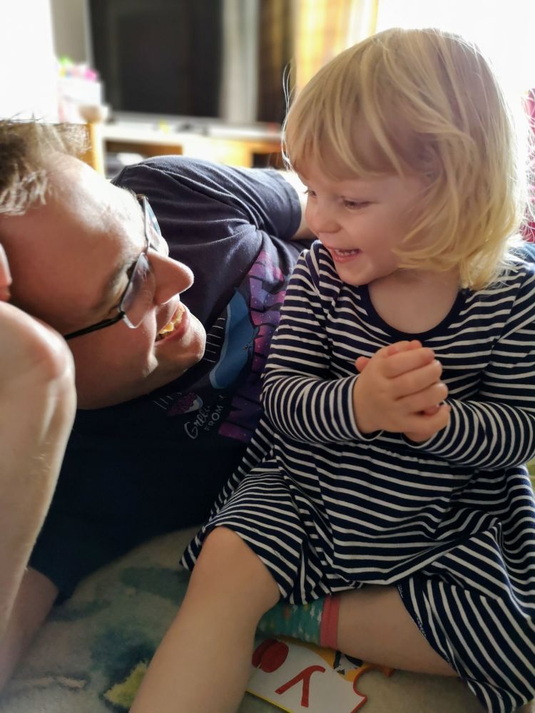Me and my daughter, grinning at each other