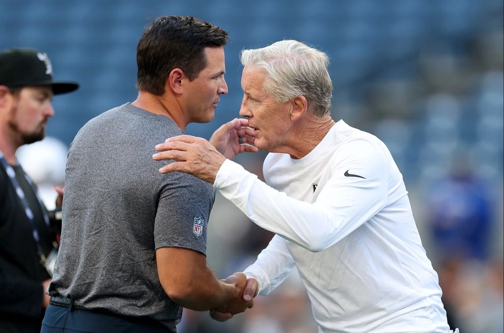 Mike Macdonald and Pete Carroll. (Photo by Steph Chambers/Getty Images)