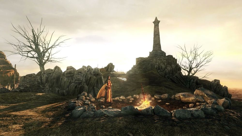 Dark Souls 2's hub zone Majula, with the Emerald Herald resting by the bonfire.