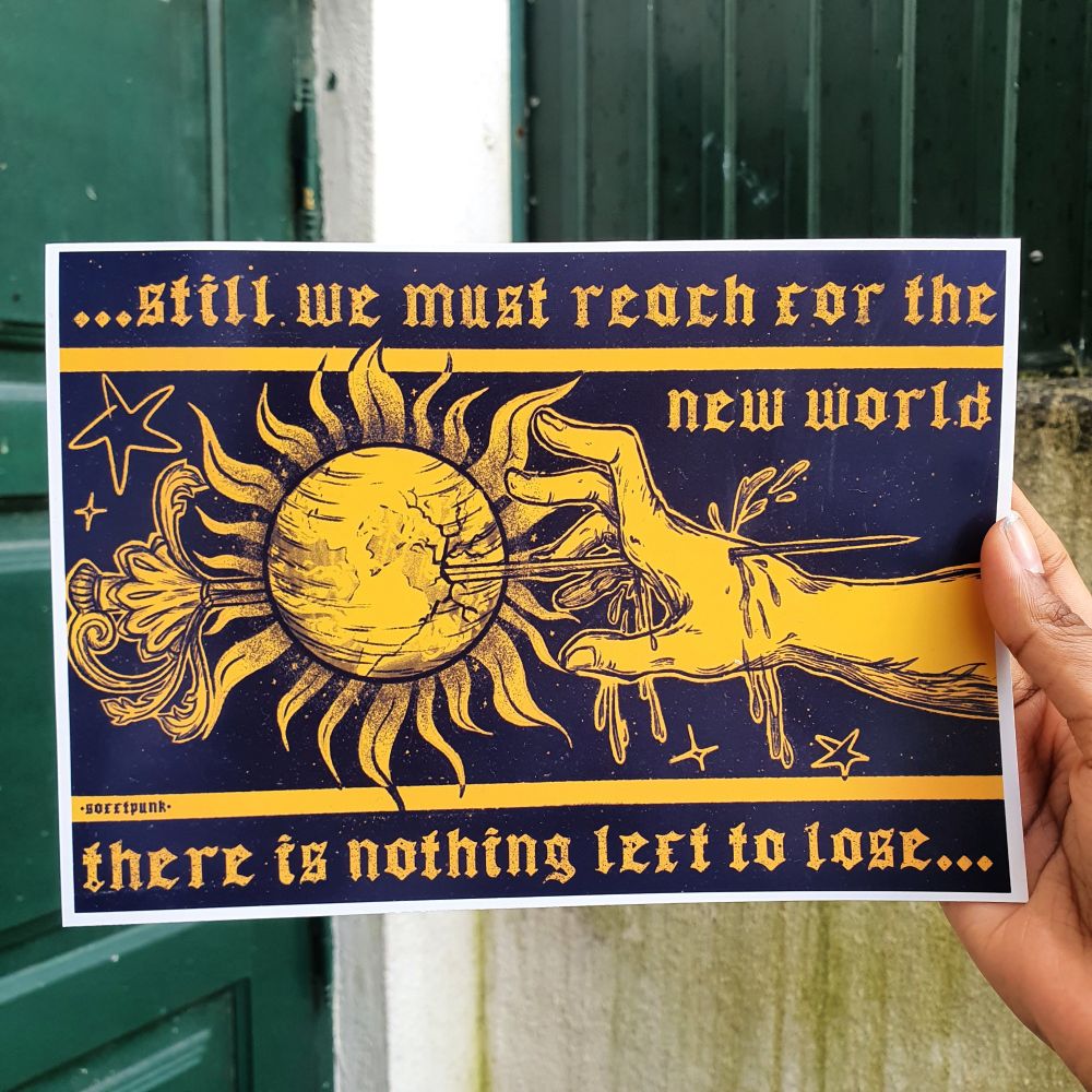 an art print is being held up in a brown hand, the print is in black and bright yellow and reads "still we must reach for the new world, there is nothing left to lose" and depicts a hand impaling itself on a sword whilst reaching for the earth impaled further 