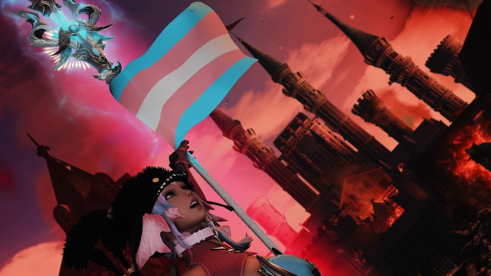 Sylari in skimpy latex and silver armor, colored pink, blue and silver, hefting a spear high and waving a rallying flag, the trans flag a symbol of hope in these dark times for the dolls. Midna rides on her shoulder, as a city and castle burn all around her.