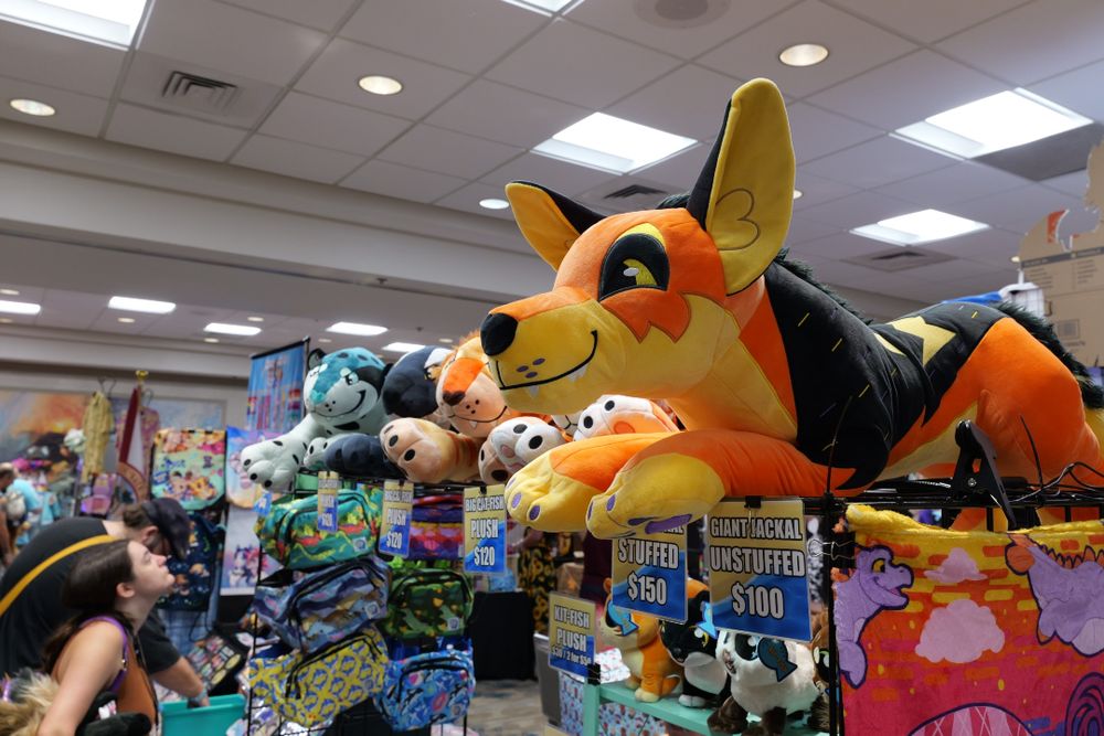 An assortment of plush stuffed animals on display at one of the chomp booths.