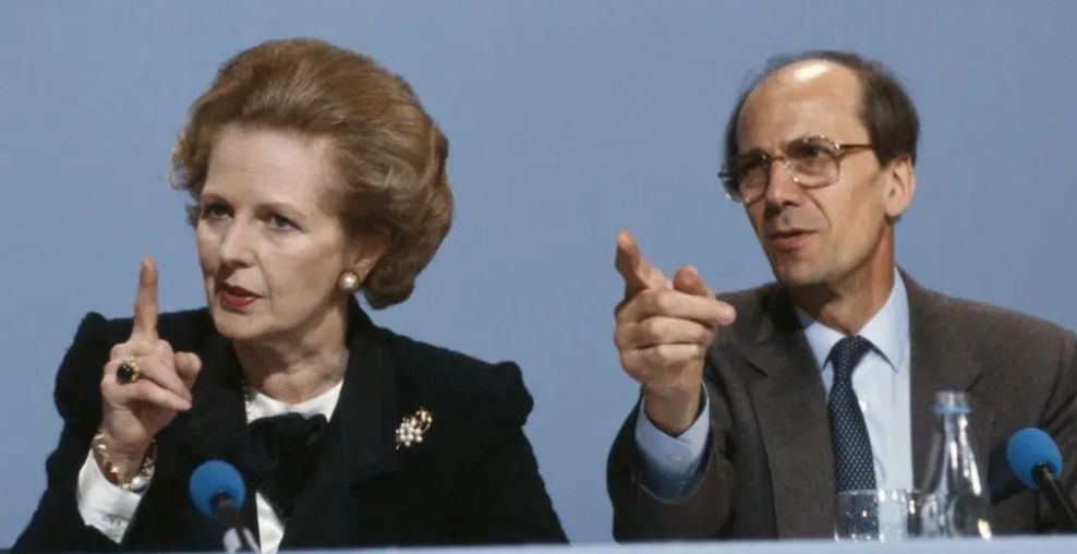 Thatcher and Tebbit pointing.