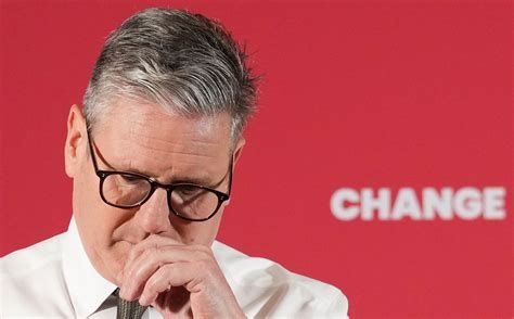 Keir starmer looking sad with his hand up to his face in front of a red backdrop that says change on it.