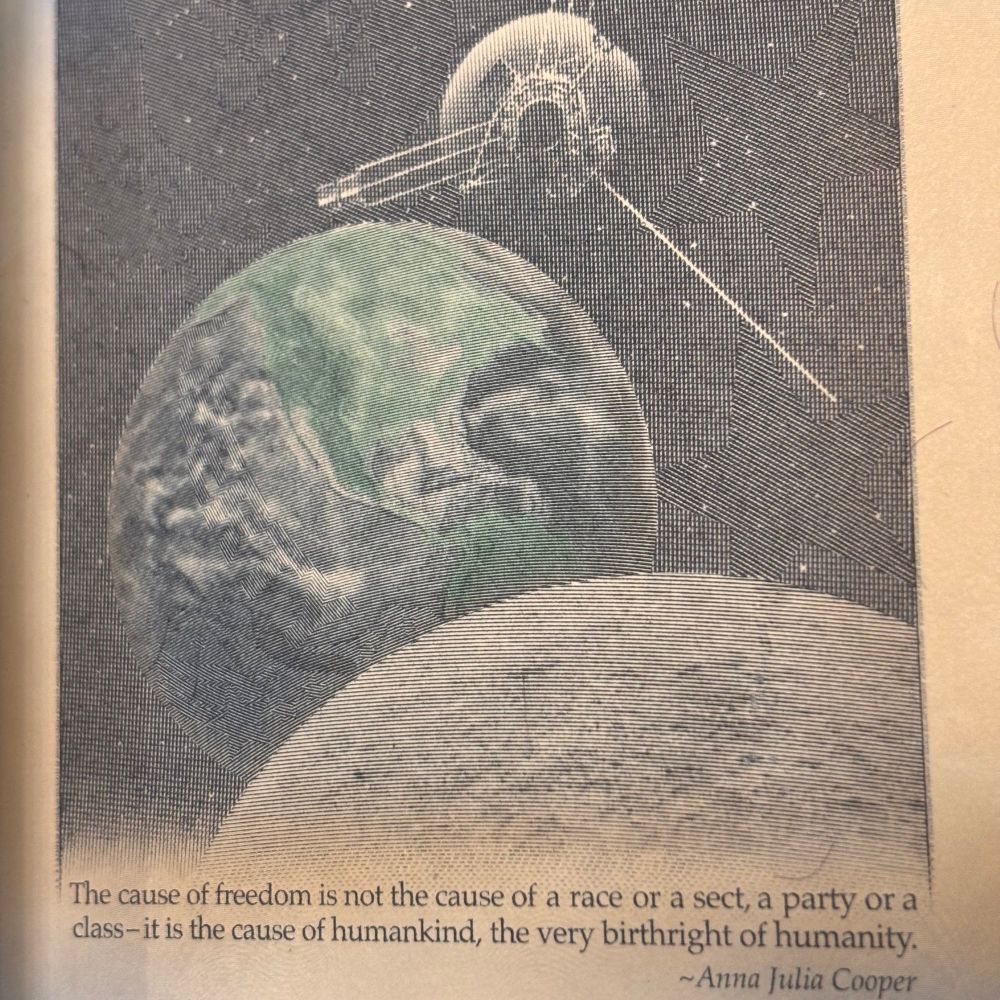 The back of an American passport with a stylized photo of the earth & moon with an Apollo craft with the Anna Julia Cooper quote “ the cause of freedom is not the cause of a race or a a party or a class it is the cause of human mankind the very birthright of humanity.”