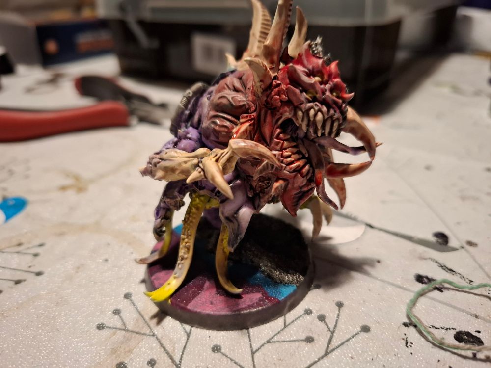 Chaos spawn. Right side, colours shift from red to purple with yellow leg tentacles 
Bone is bone coloured