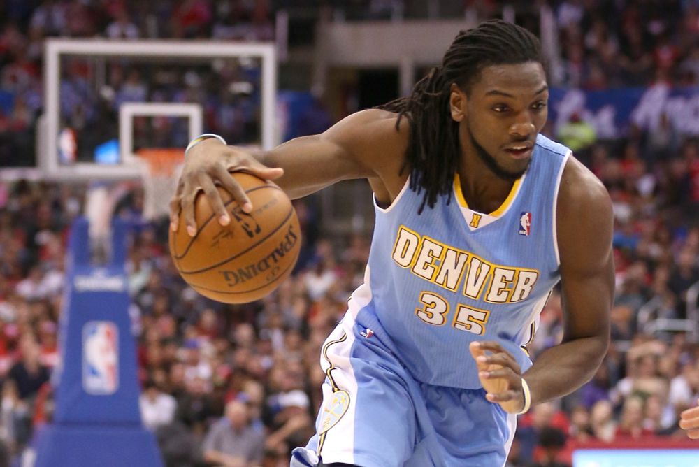 Kenneth Faried driving with the ball.