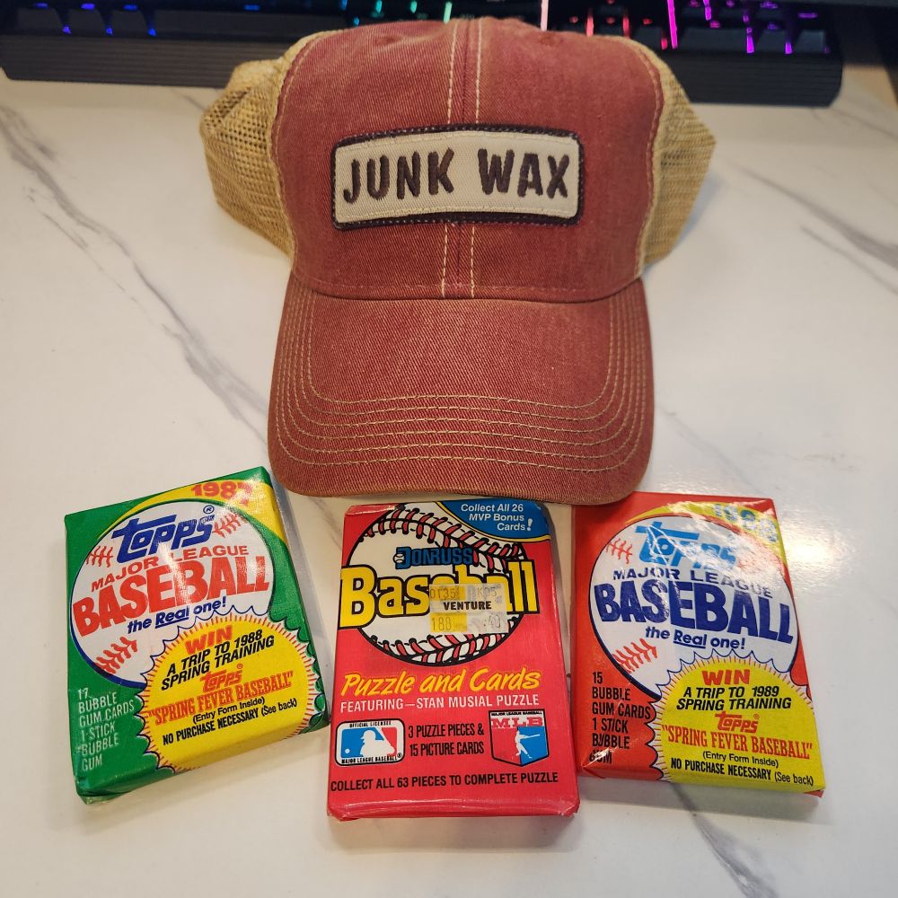 Junk Wax trucker hat with three packs of junk wax-era baseball cards. 