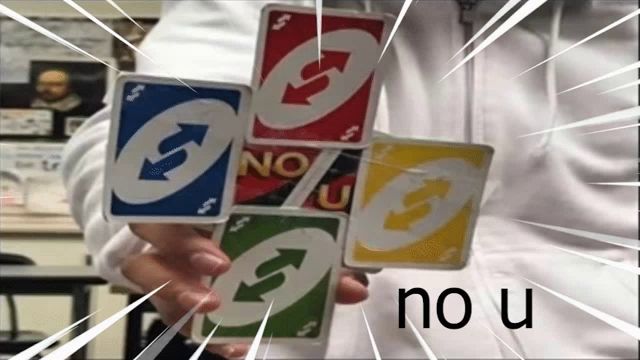 a person is holding a stack of uno cards in their hand