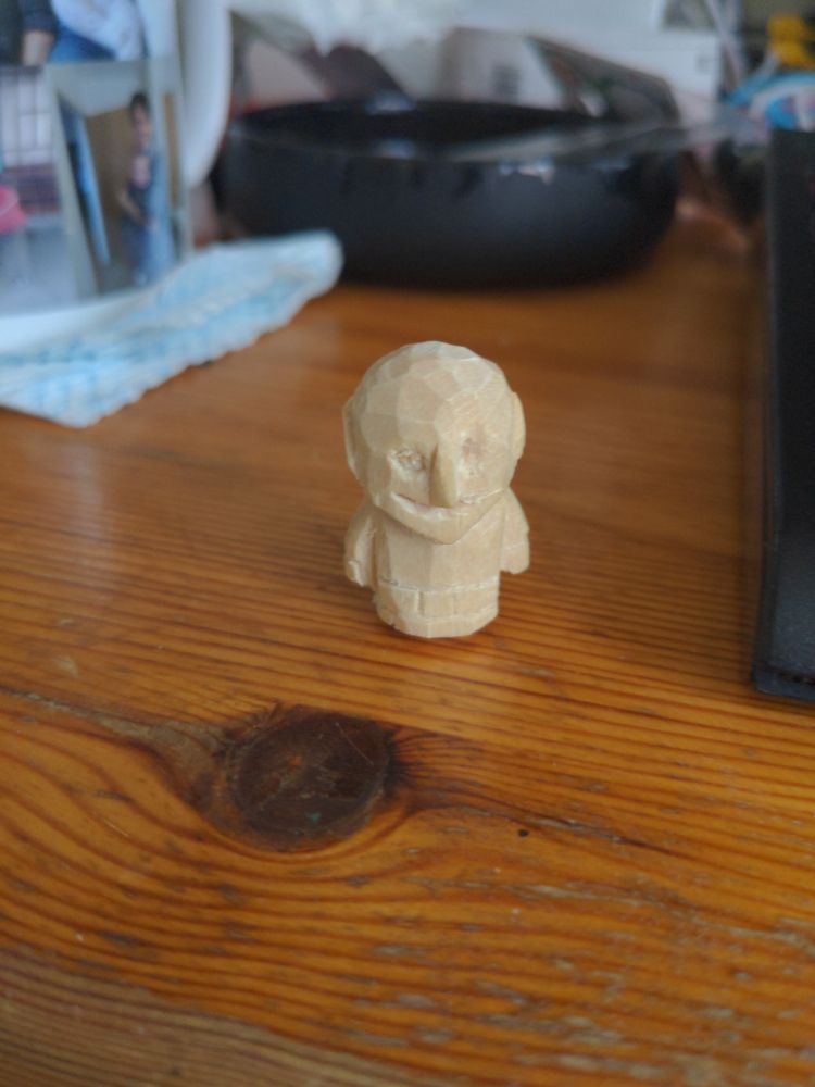 A very amateurish carved wooden goblin