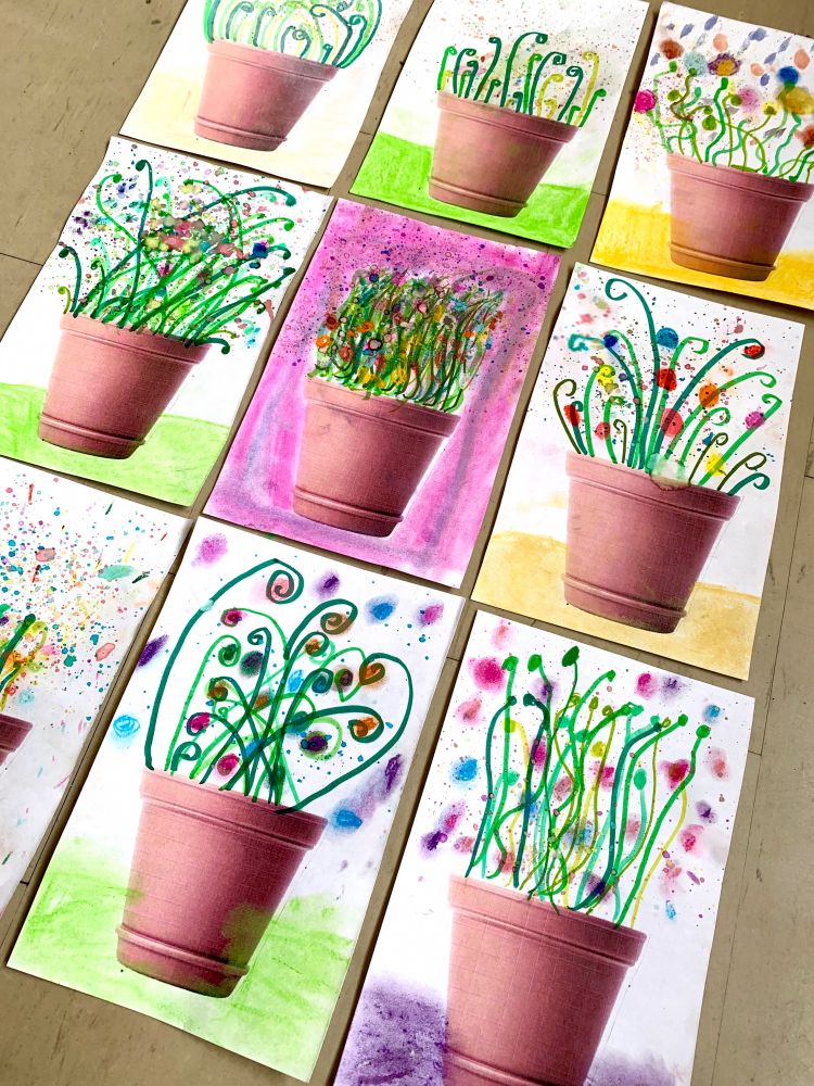 Mixed media student works of spring flowers in clay pots
