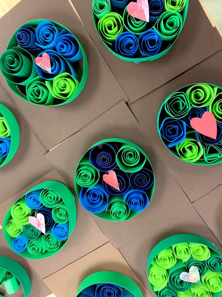 Paper quilled earths in shades of blue and green