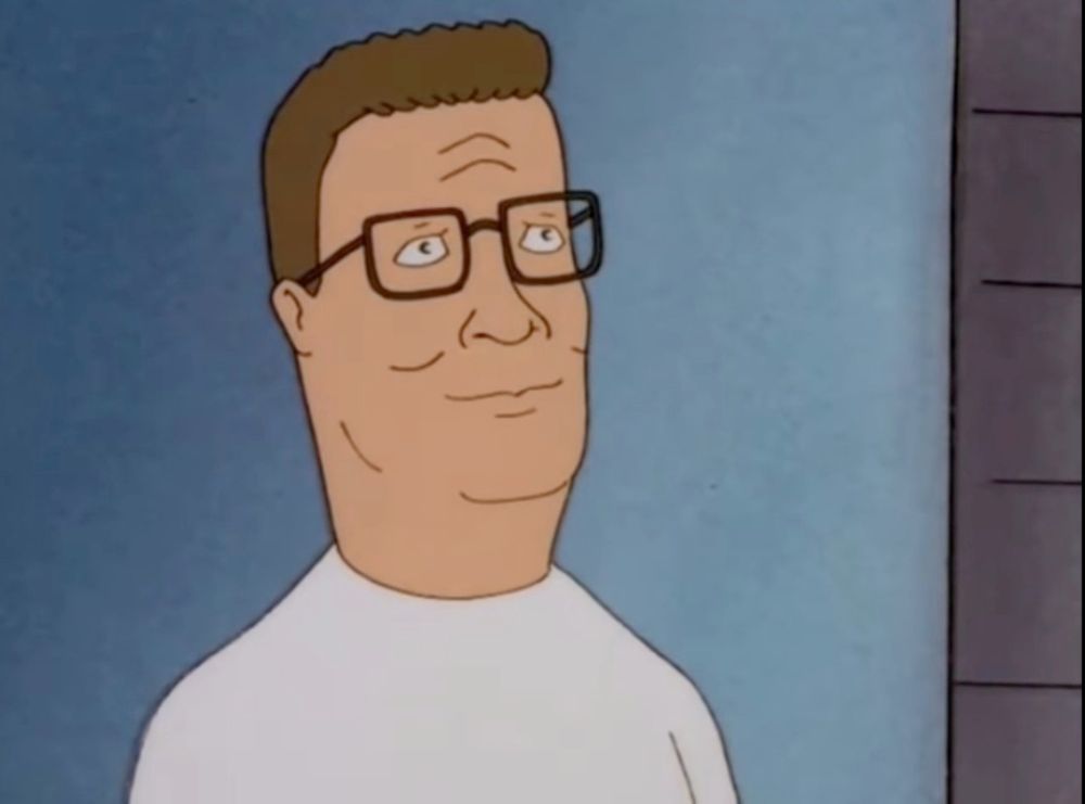 Hank Hill looking very content