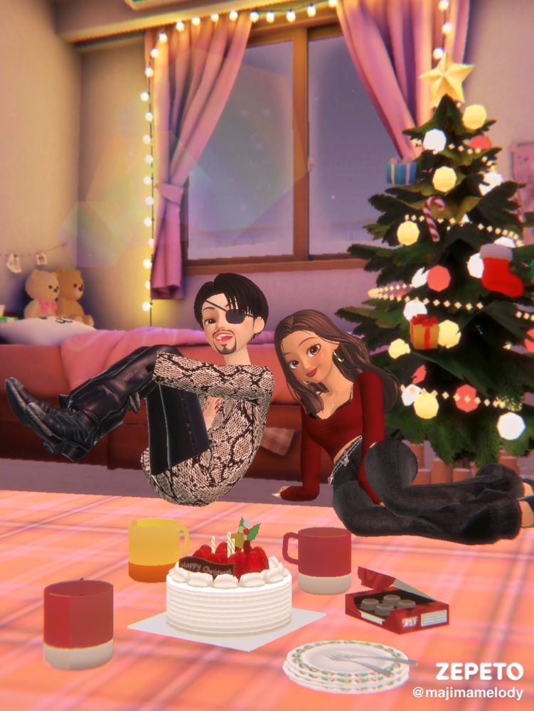 Majima and Erina enjoying each other's company in a festive-decorated room. Cake, mugs, plates and a box of sweets are on the floor. 