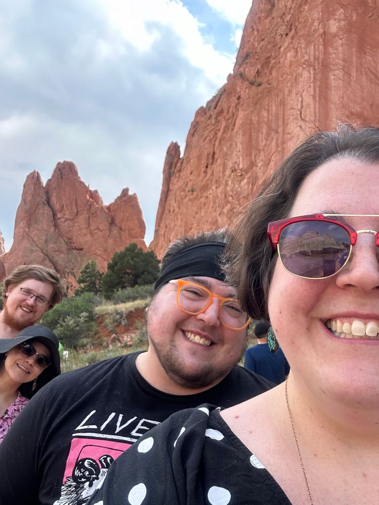 A picture of me and bones in Colorado, with my younger siblings leaning into the frame