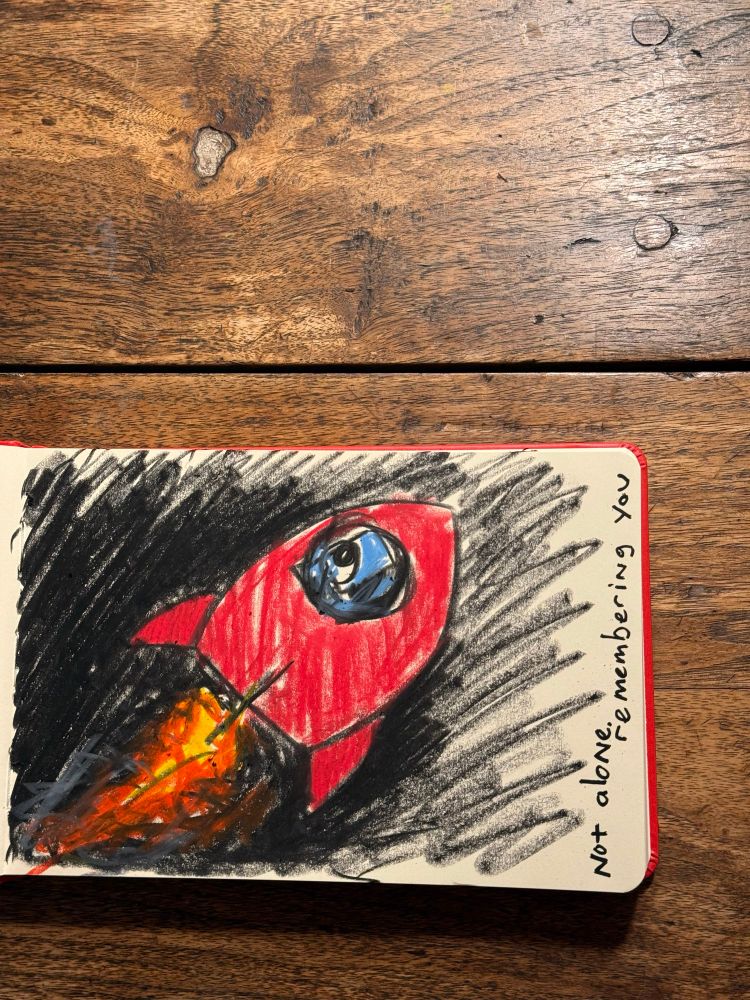 Notebook drawing of dog in rocketship