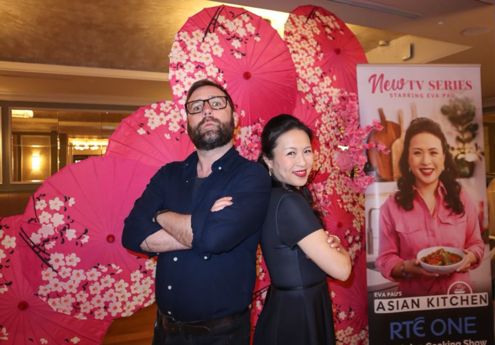 Photo of myself standing back to back with Eva Pau