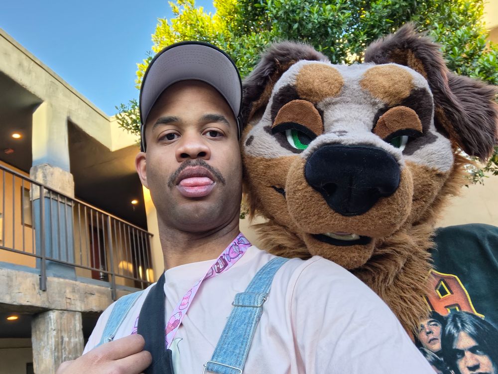 Me taking a selfie with a dog fursuiter 