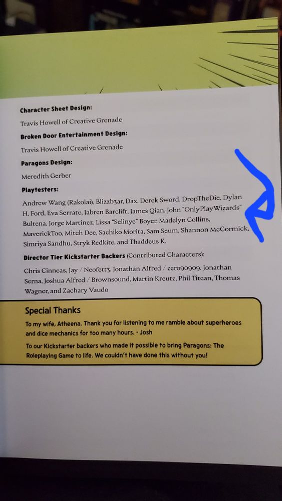 A photo of a credits page from a book with a blue arrow drawn on pointing to the name John "OnlyPlayWizards" Bultena.