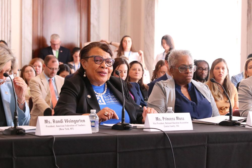 Image of NEA Vice President Princess Moss speaking at Senator Hirono's Capitol Hill forum in Washington, DC next to Randi Weingarten and Denise Forte.